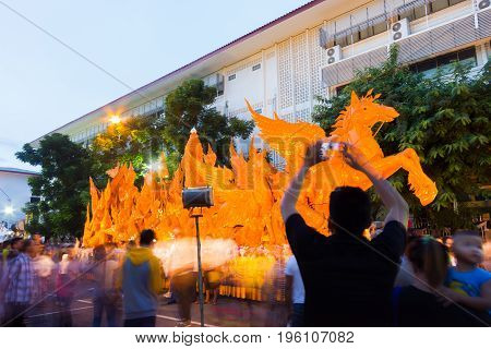 UBON RATCHATHANI THAILAND - July 8 : unidentified people visit large candle carving in the festival on July 8 2017 in Ubon Ratchathani Thailand. low speed shutter shot.