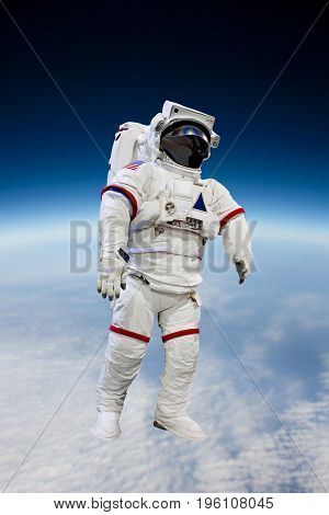 Astronaut Wearing Pressure Suit in a Space Background