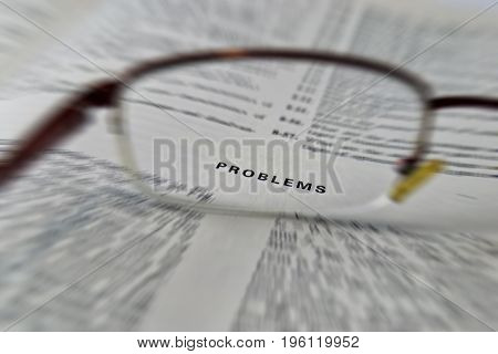 problems electronic engineering book reading with glasses on open page