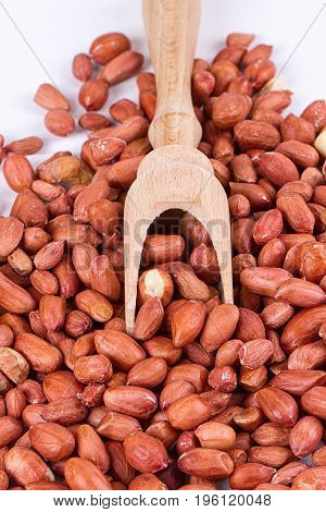 roasted peanuts with spatula close up photo