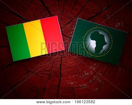 Malian Flag With African Union Flag On A Tree Stump Isolated