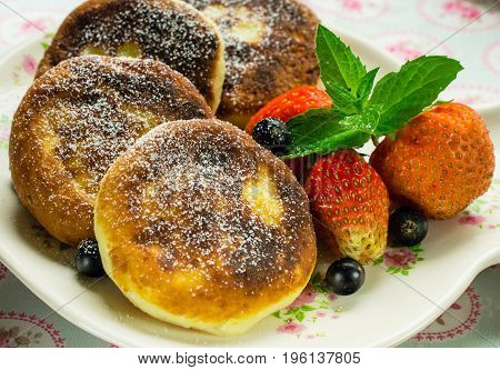 Delicious dessert. pancakes with strawberries and currants.