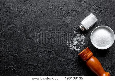 Cooking set with salt and saltcellar on kitchen dark table background top view mock up