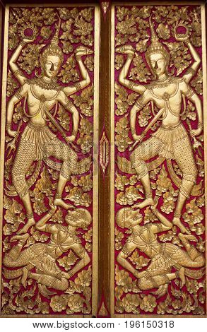 Thai art on temple door at Chiang Mai