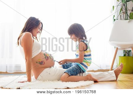 Happy Child, Boy, Painting On Mommy's Pregnant Belly