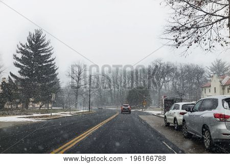 Washington Dc, Usa - January 7, 2017: Winter Snow Storm On Road With Parked Cars And Car With Break