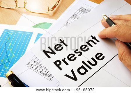 Net present value NPV documents on a table.