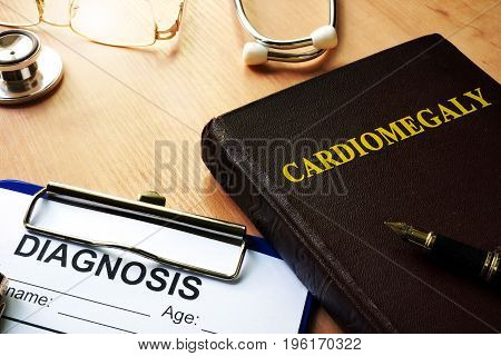 Cardiomegaly written on a front a book.