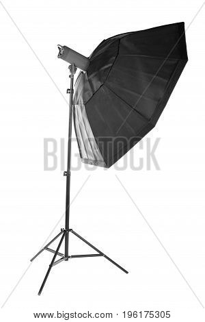 Photostudio equipment: octobox, isolated on a white background. Professional photographic lighting on a tripot. Studio flash with soft-box on white background.
