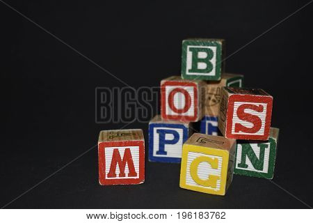 Several wooden cubes waiting for color inspiration
