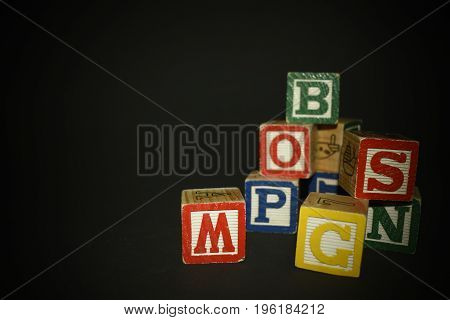Several wooden cubes waiting for color inspiration