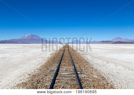 Uyuni, Bolivia - November 02, 2015: Train tracks in the famous salt flat Salar de Uyuni
