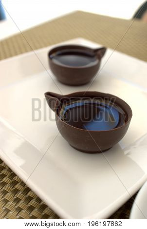 portuguese typical beverage ginginha in chocolate cup