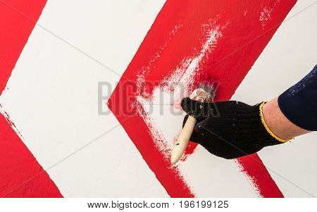 The Hand In The Black Glove Holds The Brush