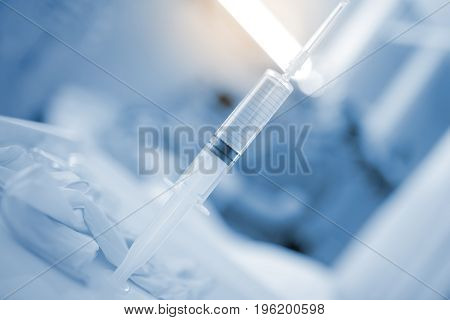 Filled syringe in the hospital ward concept of drug therapy.