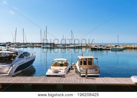 Yachts sailing boats and pleasure boats are moored in marina of Balchik city in black sea coast at Bulgaria.