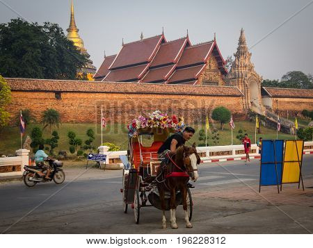 Lampang Thailand - March 17 2016: The horse carriage at Wat Phra That Lampang Luang temple