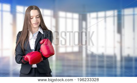 Young Beautiful Business Woman And Creative Designer Standing Over Blured Interior Background