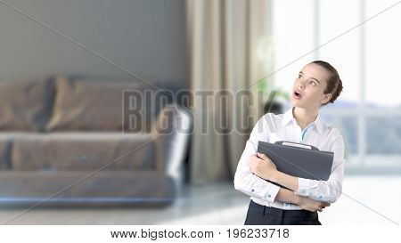 Young Beautiful Business Woman And Creative Designer Standing Over Blured Interior Background