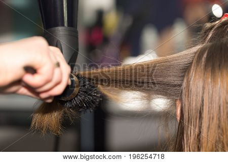 styling hair dryer in a beauty salon