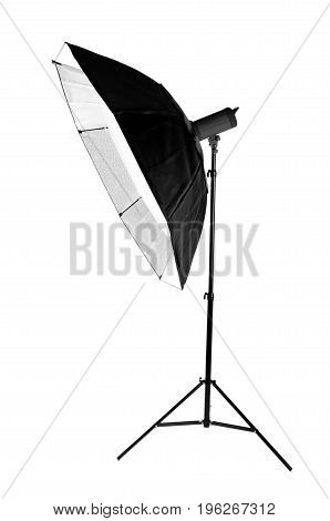 A modern electric saturated black octobox on a tripod. A huge octobox isolated over the white background. Equipment for photographers. Professional shooting in a photo studio.