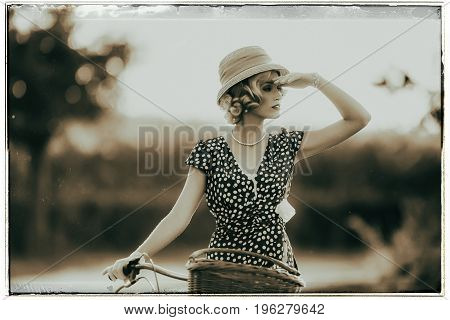 Classic Black And White Photo Of 1930S Fashion Woman In Summer Dress Standing With Bicycle In Rural