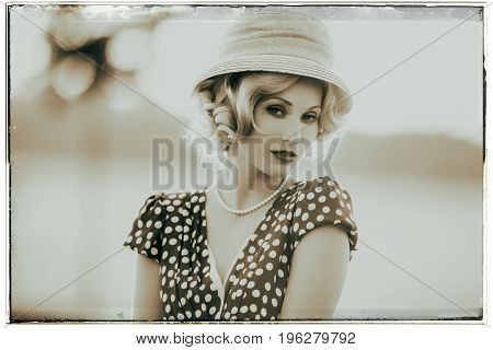 Classic Black And White Photo Of Seductive Looking Woman Wearing Vintage 1930S Fashion. Standing In