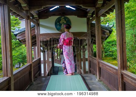 KYOTO, JAPAN - JULY 05, 2017: Unidentified woman walking through the Hojo Hall of Tenryu-ji in the Arashiyama district of Kyoto, Japan.