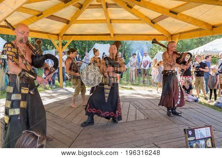 Useldange, Luxembourg, July 6, 2017. Cradem Aventure musicians stylized as the Goths performing on folk festival and playing bagpipes rock