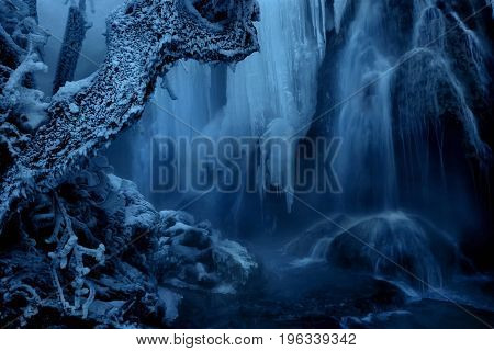 Frozen waterfall. Beautiful abstract ice scene. A misty winter day. Krushuna waterfalls in Winter. Bulgaria.