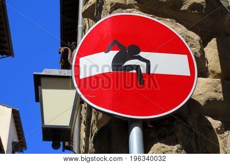 Europe stop sign with sticker bent man walking out