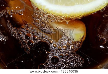 cold ice tea with bubbles and lemons
