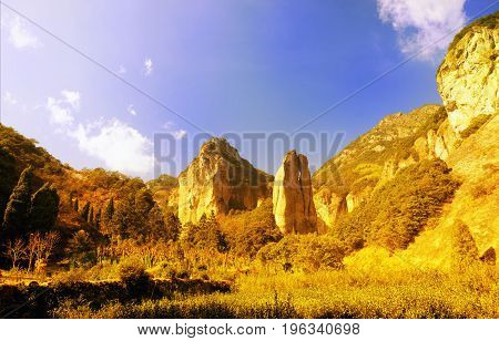abstract picture of Scissors Peak shaped rocks rising up from the ground at the Dalong Waterfall scenic area in Yandangshan mountain area located in Zhejiang province China.