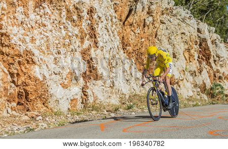 Col du Serre de TourreFrance - July 152016: The British cyclist Christopher Froome of Team Sky in Yellow Jersey is riding during an individual time trial stage in Ardeche Gorges on Col du Serre de Tourre during Tour de France 2016.