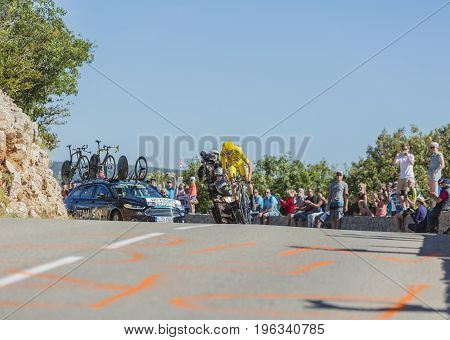 Col du Serre de TourreFrance - July 152016: The British cyclist Christopher Froome of Team Sky in Yellow Jersey is riding during an individual time trial stage in Ardeche Gorges on Col du Serre de Tourre during Tour de France 2016.