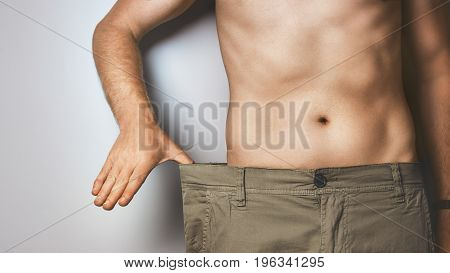 Young Man Shows How Much He Lost Weight