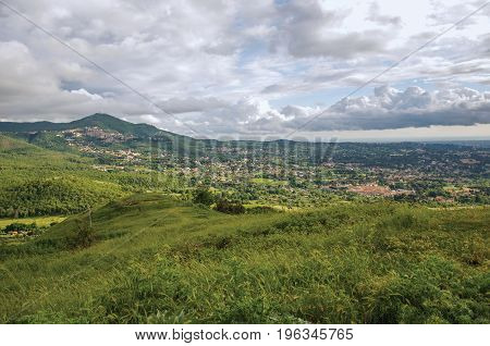 View of houses, fields, forests and hills in a cloudy day near the town of Frascati, a pleasant and well known place for its fine wines, near Rome. Located in the Lazio region, central Italy