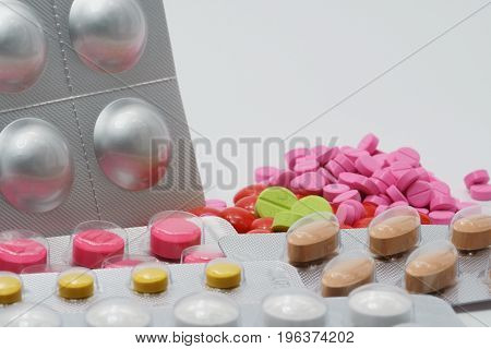 Tablets in blister pack on white background