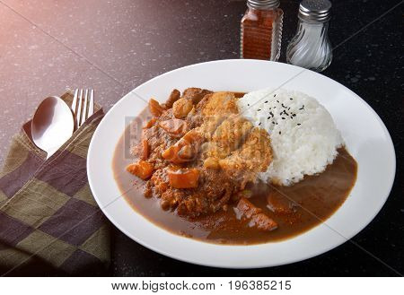 Rice With Deep Fried Pork And Curry .