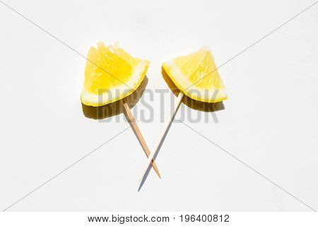 Lemon on chopsticks for eating at a party