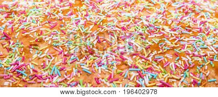 Sugar sprinkle decoration for cake and bekery a lot of sprinkles as a background