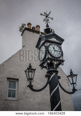Street clock with compass rose in Ullapool Scotland