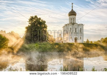 Church of the Intercession on the Nerl with glowing morning fog in Bogolubovo Vladimir oblast Russia
