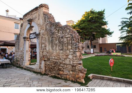 POREC CROATIA - JULY 14: Old Arch in Dobrile Juraj Square Porec on July 14 2017