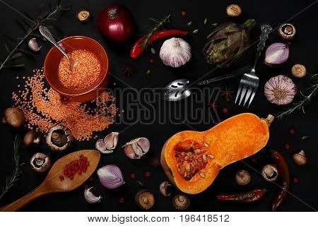 Сomposition of vegetables and cereals on a black background