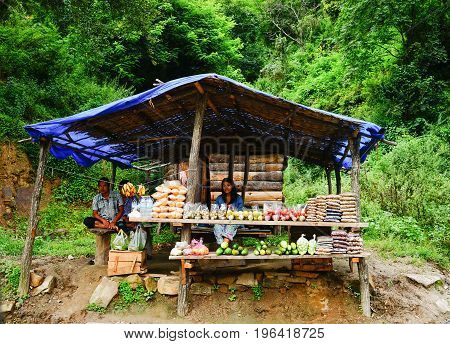 People Selling Fruits On Mountain Road