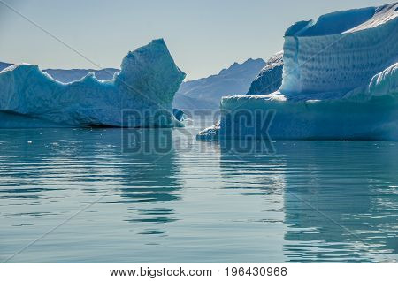 Small icebergs and reflections near the coast Greenland