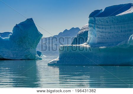Small icebergs and reflections near the coast Greenland