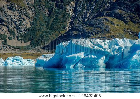 Small icebergs and reflections near the coast Greenland