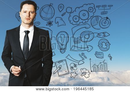 Businessman drawing business sketch in bright blue sky. Infograohic concept